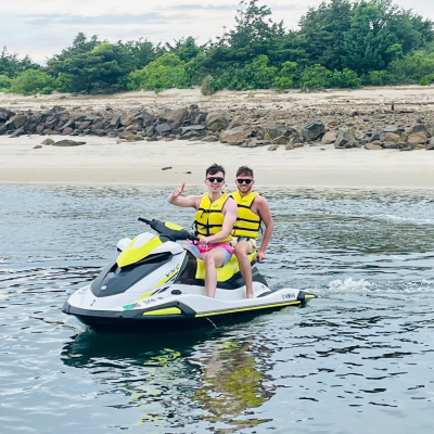 Guided Jet Ski Tour on Cape Cod Bay Two riders exploring Cape Cod Bay on a jet ski near a hidden beach during a guided jet ski tour with Dennis Parasail & Jet Ski