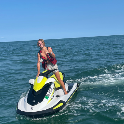 Jet Ski Fun with Dennis Parasail & Jet Ski Guest enjoying a jet ski adventure on Cape Cod Bay with Dennis Parasail & Jet Ski, cruising across the ocean on a sunny day.